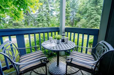 a table and two chairs on a porch with a table at Gorgeous Studio Condo in Blue Mountains Sleeps 4 in Blue Mountains