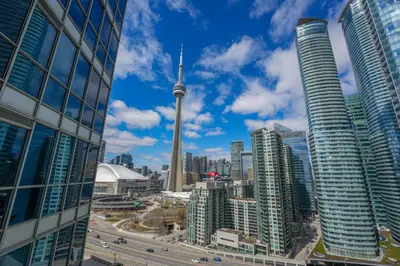 a view of the cn tower from a city at Toronto Views ~ Pool ~ BBQ ~ Harbourfront ~ WIFI in Toronto