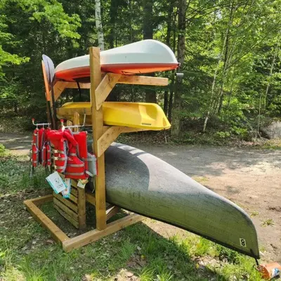 a group of boats sitting on top of a water slide at The Hidden Porch at Sir Sam's (hot tub & sauna) in Haliburton