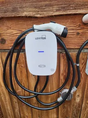 a electronic device is hooked up to a cord at Red Cedar Chalet on Brady Lake in Hindon Hill