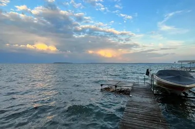 a boat sitting on a dock in the water at 2889 Purvis Street in Innisfil