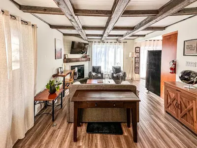 a living room with a desk and a table at 40BKickBack in Collingwood