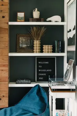 a room with a desk with a laptop on a shelf at Woodland Chase in Wellington