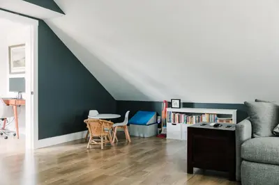a living room with a couch and a table at Woodland Chase in Wellington