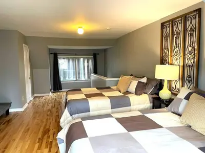 a bedroom with two beds and a window at Superb Spacious Loft Old Toronto near Distillery District in Toronto