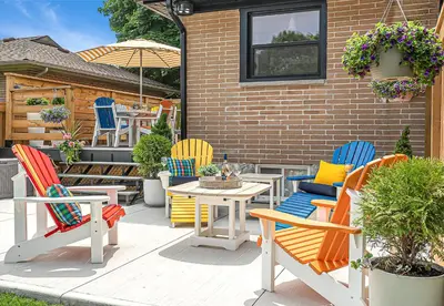 a patio with colorful chairs and a table at Luxury Family Home in Burlington in Burlington