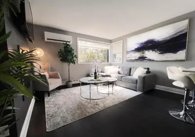 a living room with a couch and a table at Elegant City Living - 1 BR in London