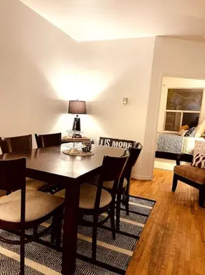 a dining room with a table and chairs at Vintage 2 bed 2 bath suite Distillery District in Toronto