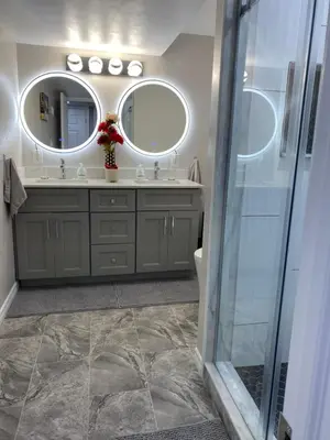 a bathroom with a sink and a mirror at Brand new apartment with private entrance and patio in Guelph