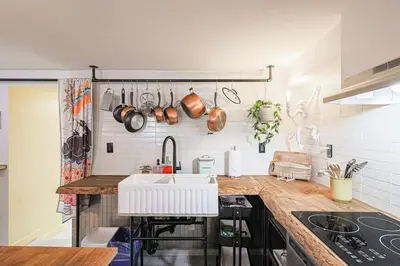 a kitchen with a sink and a counter with pots and pans at Spa Oasis in Toronto's Heart-Free Parking! and Pet Friendly in Toronto