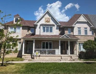 a large brick house with a star on the roof at \u65b0\u58f9\u5bb6\u6c11\u5bbf202 in Markham
