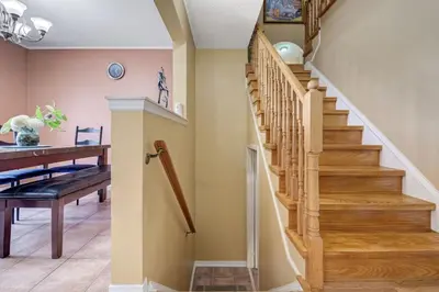 a staircase in a home with a table and a desk at Brampton Retreat - Quiet 2BR Residential Area in Brampton