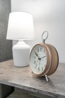 a clock sitting on a table next to a lamp at Haven Suite in London, On 2Br, 1Bath with free washer and dryer in London