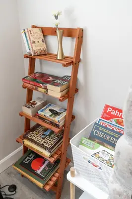 a book shelf filled with books and magazines at Haven Suite in London, On 2Br, 1Bath with free washer and dryer in London