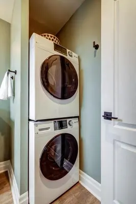 two microwaves stacked on top of each other in a room at From HGTV Marigold Suite in county farmhouse in West Lake