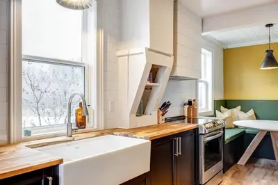 a kitchen with a large white sink and a window at From HGTV Marigold Suite in county farmhouse in West Lake