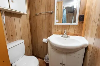 a bathroom with a white sink and a toilet at Enjoy Relax at Rice Lakes in Bailieboro