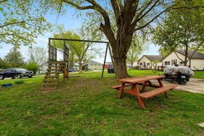 a park with a picnic table and a tree at Enjoy Relax at Rice Lakes in Bailieboro