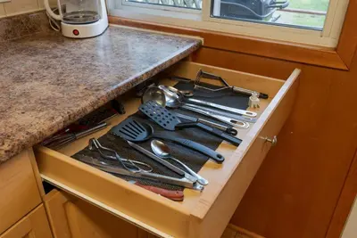 a drawer filled with cooking utensils on a kitchen counter at Dive into Nature at Rice Lake in Bailieboro