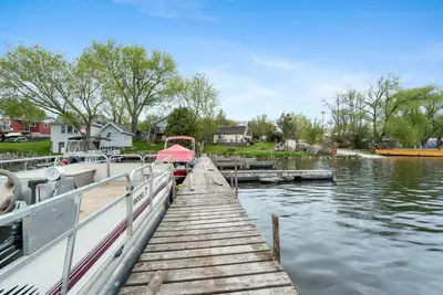 a boat is docked at a dock on a lake at Beautiful Lake Views in Nature in Bailieboro