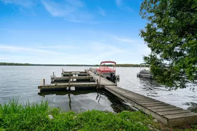 a boat is docked at a dock on a lake at Beautiful Lake Views in Nature in Bailieboro