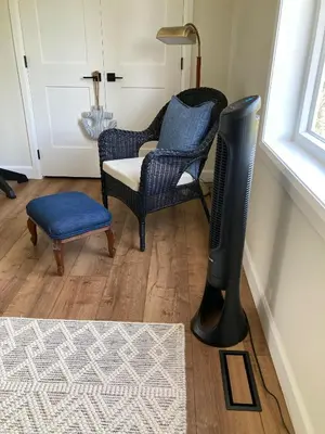 a living room with a chair and a lamp at The Loft Retreat in Southampton