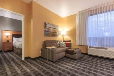 a hotel room with a couch and a bed at TownePlace Suites by Marriott Belleville in Belleville