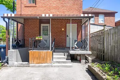 a front porch of a brick house at Stylish & Inviting Private Bedroom in Corso Italia in Toronto