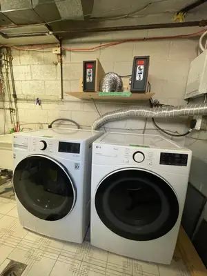a washer and dryer sitting in a garage at Toronto Room with Balcony - Midtown in Toronto