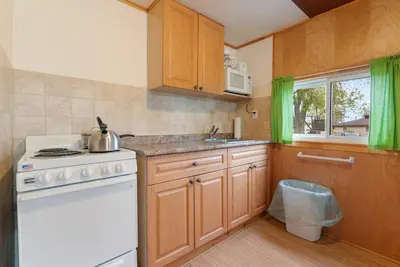 a kitchen with a white stove and a sink at Peaceful Getaway in Bailieboro