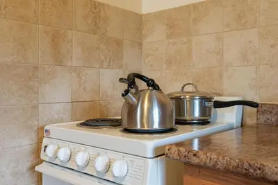 two pots and pans on a stove in a kitchen at Peaceful Getaway in Bailieboro