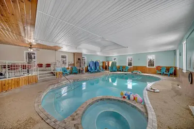 a large swimming pool in the middle of a room at Marmora and Lake Inn and Victorian Diner-2025 Group Reunion Home for up to 32 guests in Marmora