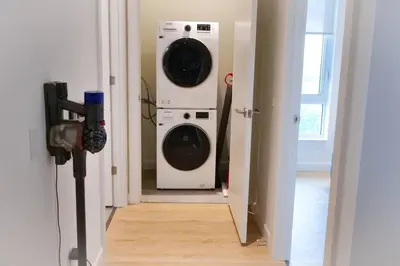 two washer and dryer in a hallway of a house at 2bhk Luxury brand new pvt suite Kitchener in Kitchener