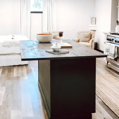 a kitchen with a large island in a living room at Cellar Suite at Winery and Vineyard in Waterford