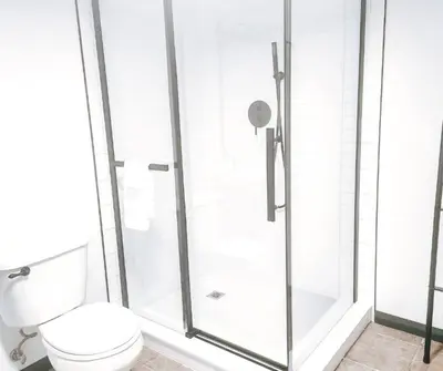a bathroom with a shower with a toilet at Cellar Suite at Winery and Vineyard in Waterford