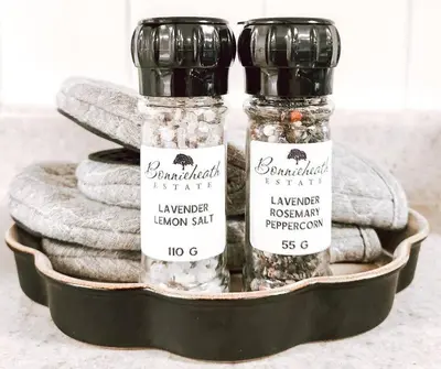 two bottles of salt in a basket with towels at Cellar Suite at Winery and Vineyard in Waterford