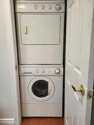 a washer and dryer in a small room at Downtown Toronto House Central 2BED 2BATH Subway Free Parking in Toronto