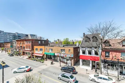 a city street with cars parked on the street at 1BR - Queen Bed Apartment in Hamilton's Best Neighborhood in Hamilton