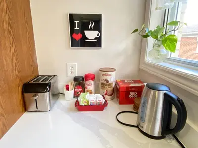 a kitchen counter with a coffeemaker and a coffee maker at Sunny House - Main Floor, Free parking, in Toronto in Toronto