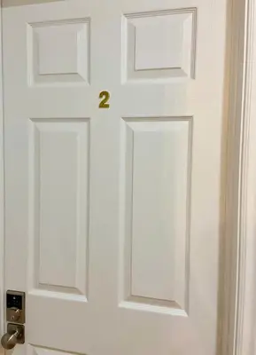 a white door with the number on it at Sunny House - Main Floor, Free parking, in Toronto in Toronto