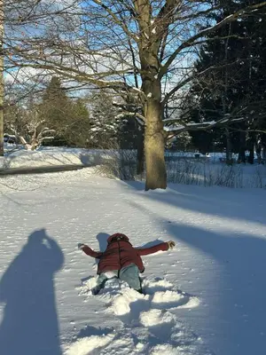 a person is laying in the snow at Luxury Apartment Living in Mississauga
