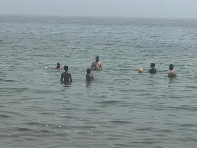 a group of people swimming in the water at Luxury Apartment Living in Mississauga