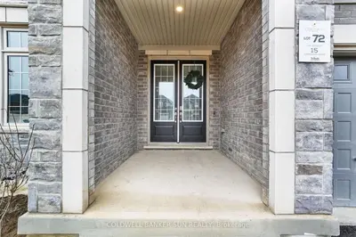 a front door of a brick building with a blue door at Cozy 5 bedrooms & 5 bathrooms House in Tottenham