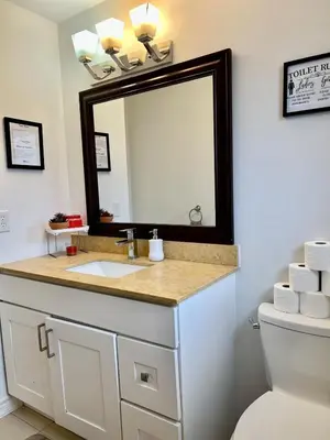 a bathroom with a sink and a mirror at Private Room Near Airport K3 in Mississauga