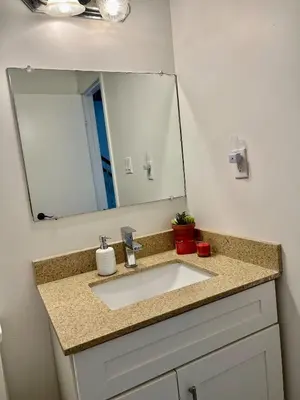 a bathroom with a sink and a mirror at Private Room Near Airport K9 in Mississauga