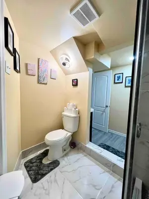 a bathroom with a toilet and a walk in shower at Private Room Near Airport K8 in Mississauga