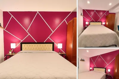 a bedroom with a purple wall and a bed at Private Room Near Airport K4 in Mississauga