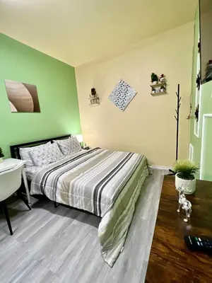 a bedroom with a bed and a desk and a sink at Private Room Near Airport K6 in Mississauga