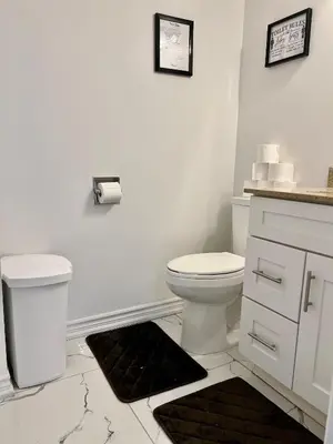 a white bathroom with a toilet and a sink at Private Room Near Airport K6 in Mississauga