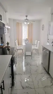 a kitchen and dining room with a table and chairs at Private Room Near Airport K6 in Mississauga